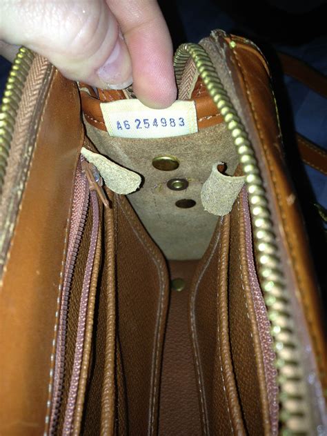 dooney and bourke fake serial number j7404371|How to Spot Fake Dooney and Bourke Handbags .